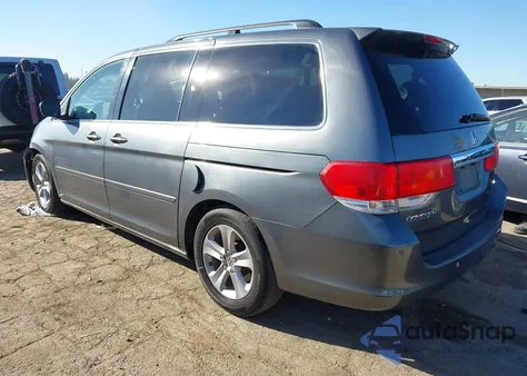 2010 Honda Odyssey Touring z USA, uszkodzony, nr VIN 5FNRL3H98AB053714